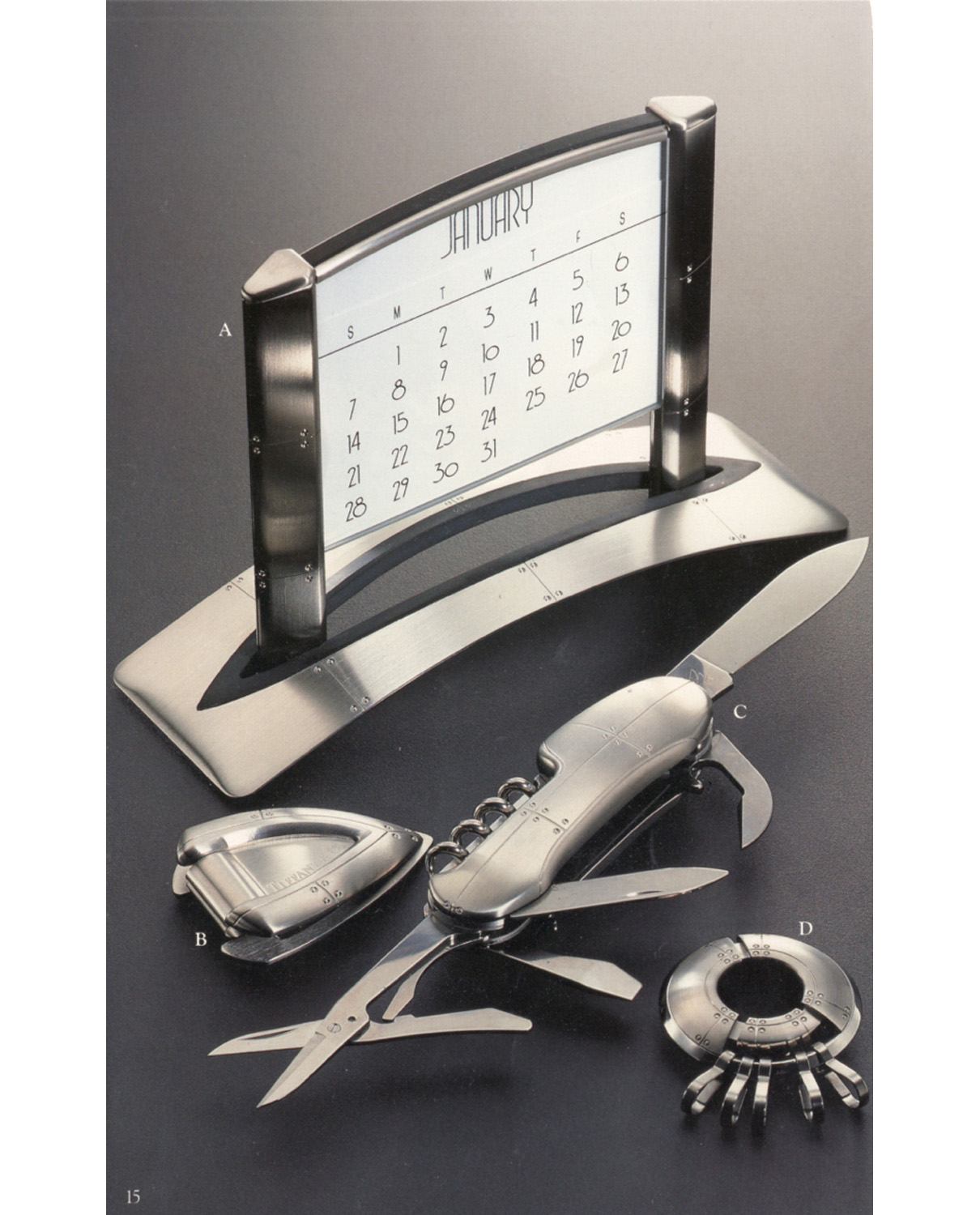 •	Tiffany & Co. Blue Book Catalog late 90's Streamerica Stainless Steel Collection: Airframe Perpetual Calendar, Laminar Money Clip, Carapace Pocket Knife, and Porthole Keyring.